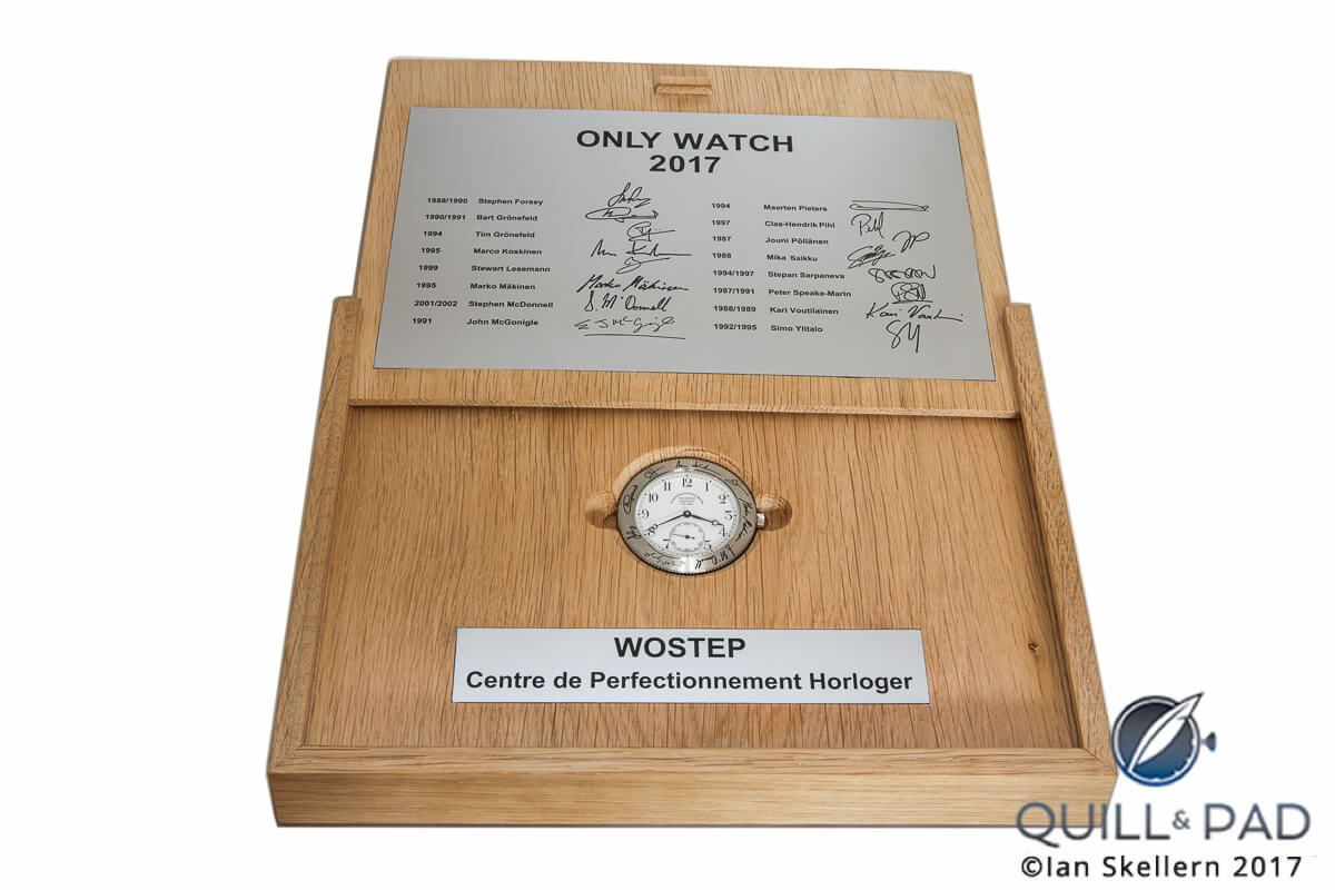 Sliding the presentation case cover open to view the WOSTEP School Watch for Only Watch 2017