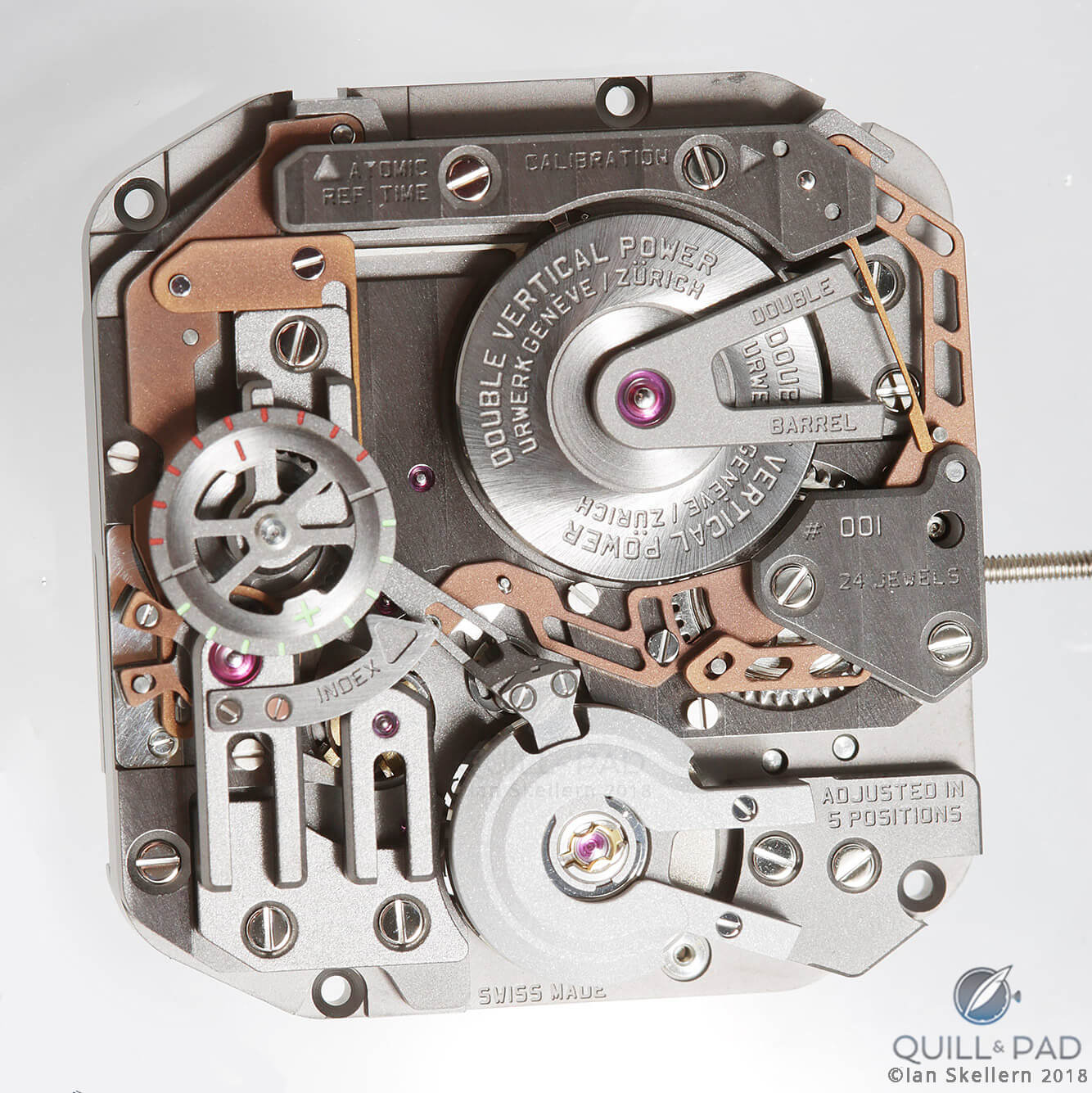 Urwerk AMC (Atomic Mechanical Control) wristwatch slave movement.The tan-color components are those that communicate with the atomic master clock