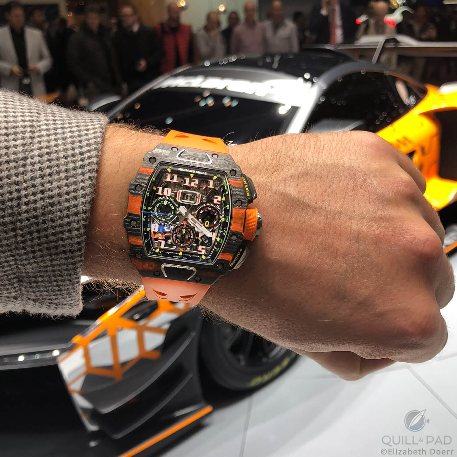 Richard Mille RM-11-03 McLaren Automatic Flyback Chronograph in front of the McLaren Senna GTR Concept at the 2018 Geneva Motor Show