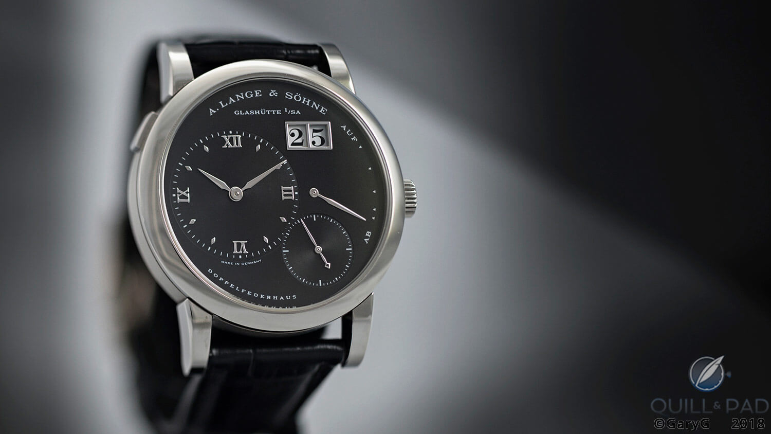 Lange 1 in stainless steel with black face