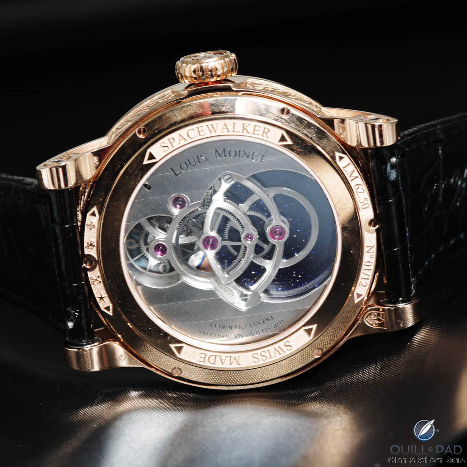 View from the back of the open movement of the Louis Moinet Spacewalker to the scintillating adventurine galaxy beyond