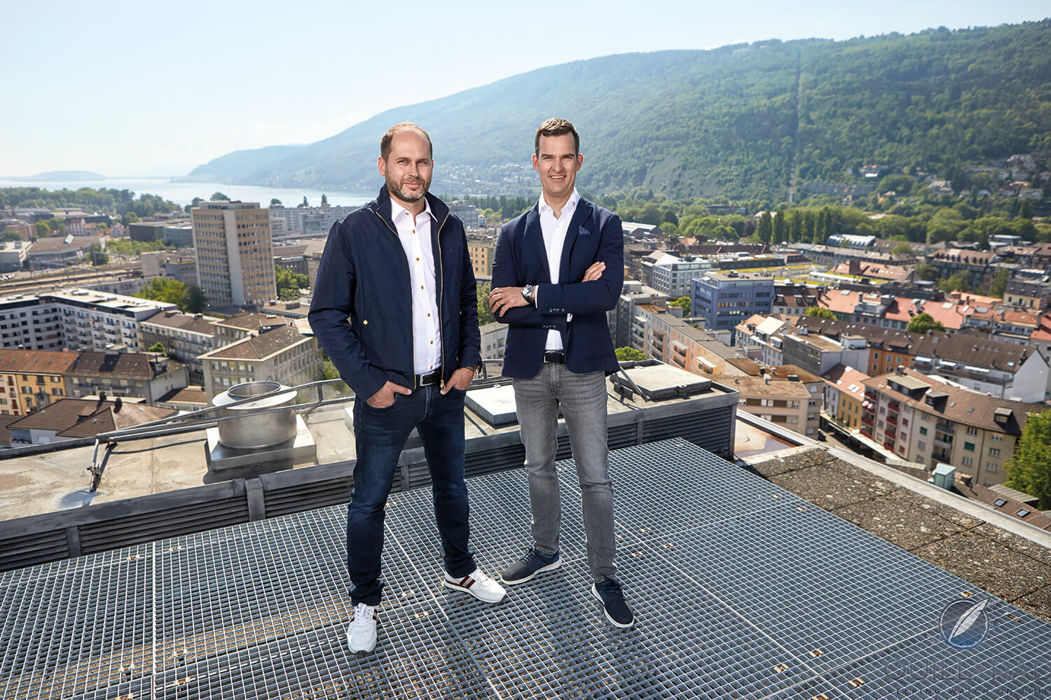 Armin Strom's Serge Michel (left) and Claude Greisler over Biel, where the factory is located