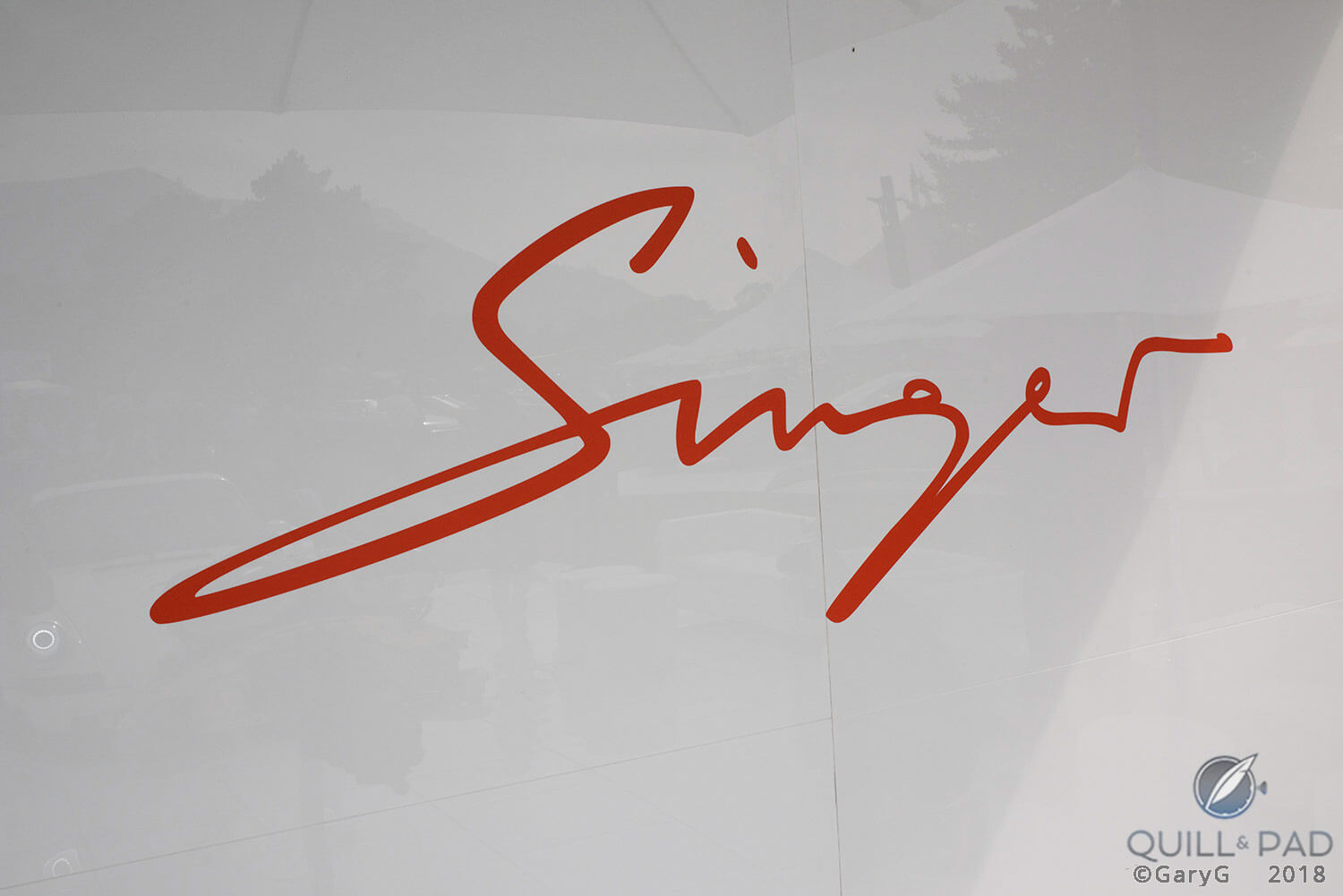 Parting shot: Singer logo on display at Singer Vehicle Design booth, The Quail 2018