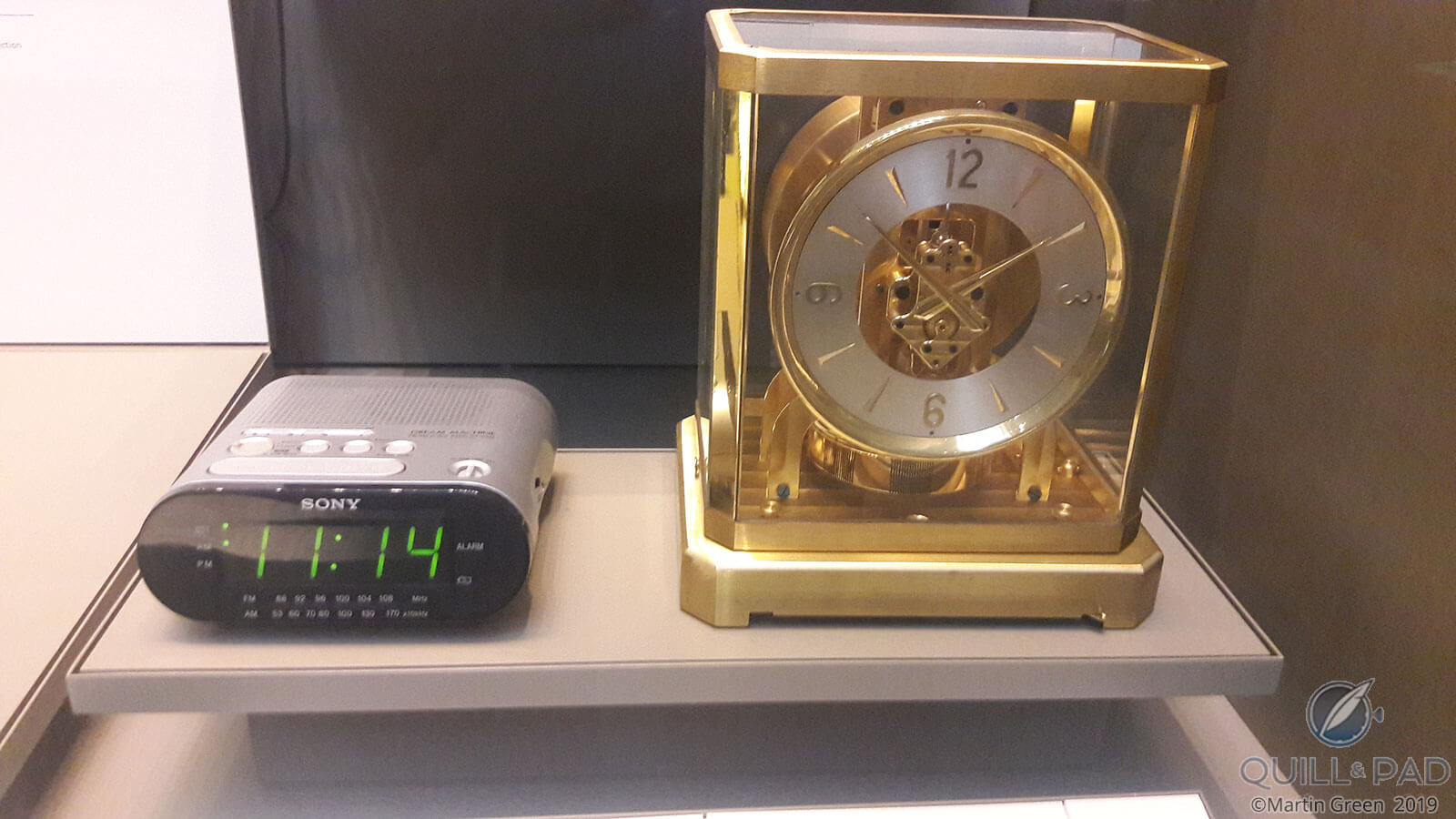 Sony alarm clock and a Jaeger-LeCoultre Atmos side by side at the British Museum